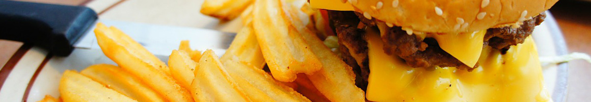 Eating Burger at Bun N Burger restaurant in Alhambra, CA.